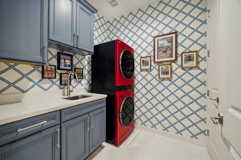 Located on the third floor the spacious laundry room is such a game-changer. There is plenty of countertop for folding, cabinets for storage.