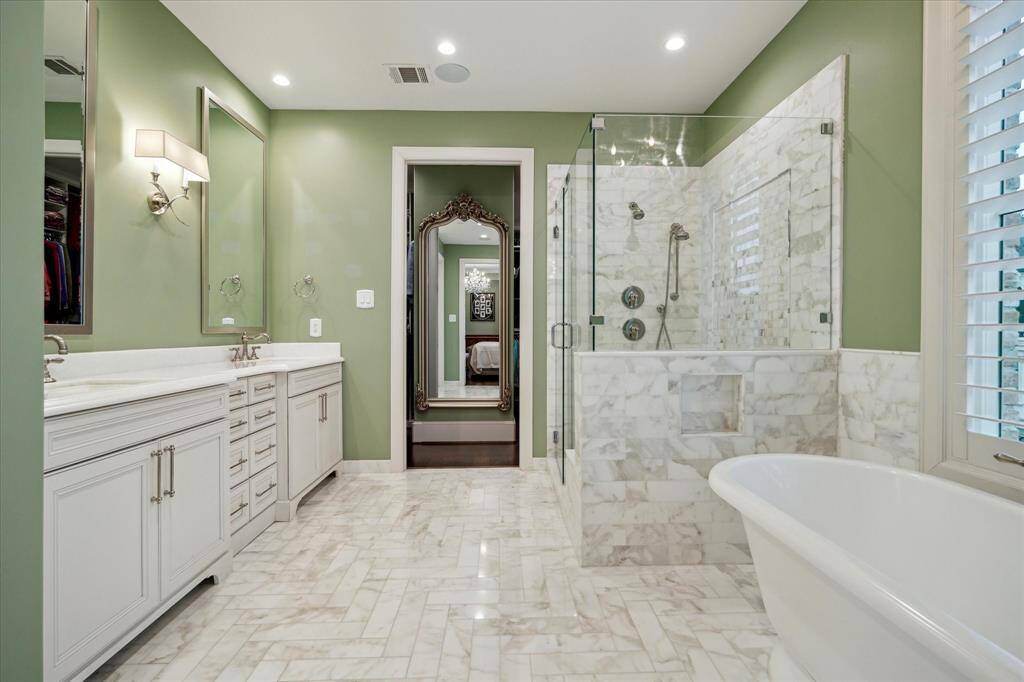 Primary bath will leave you wanting more. Detailed flooring and a large walk-in closet, designer-finished.