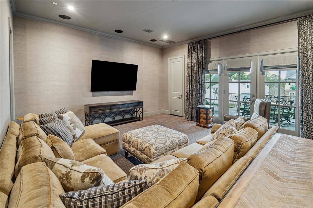 Fourth floor features an oversized entertainment room. Spacious full bath. Double doors lead to outdoor deck over looking park.