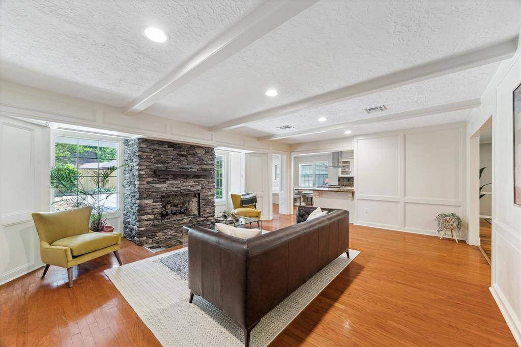 The family room with stacked stone fireplace is a very inviting place to relax