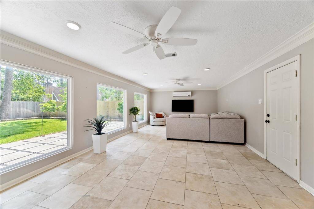 Such a great space in game room with tile flooring - door leads to attached 2 car oversized garage