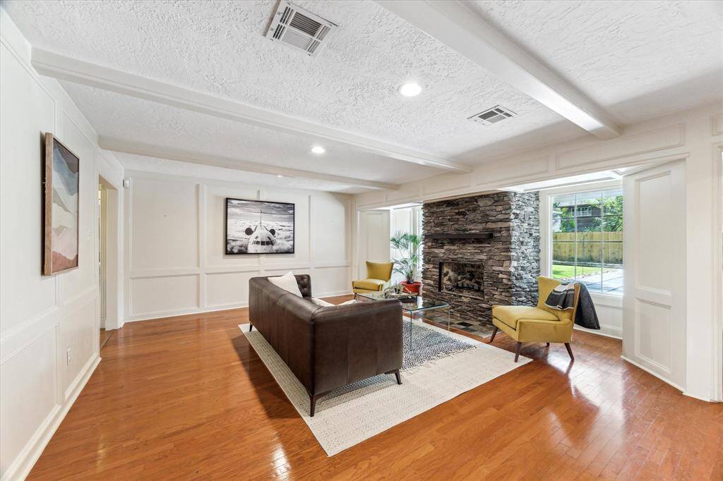 Family room with large newer windows outlooking the back yard