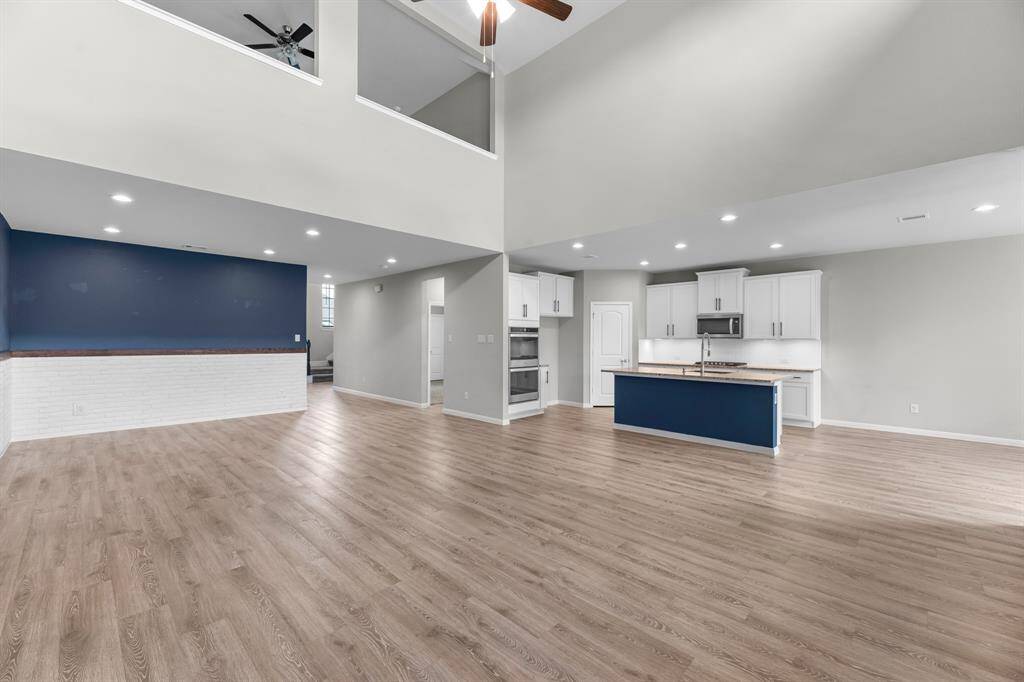 The tall ceilings and open-concept design create a bright, airy atmosphere throughout the home, enhancing the sense of space and flow—perfect for modern living and effortless entertaining. And don’t let the high ceilings be a concern—thanks to the home's energy-efficient features, you'll enjoy surprisingly low electric bills without sacrificing comfort.