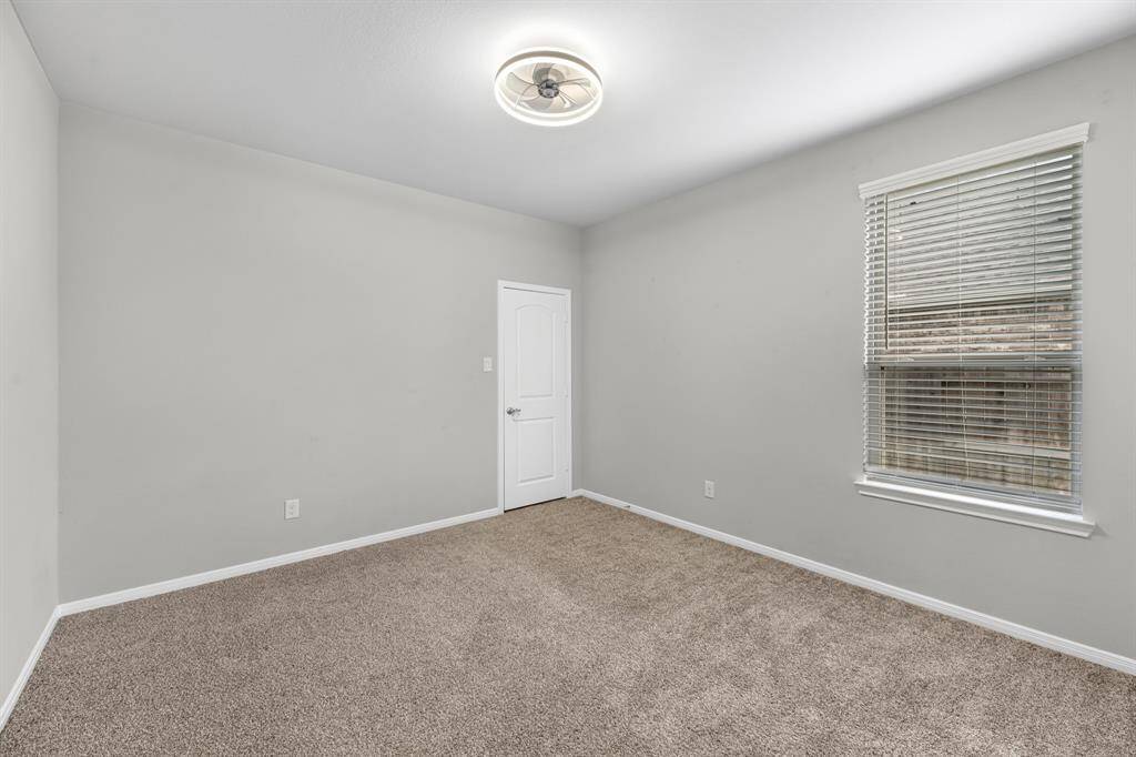 The secondary bedroom downstairs is perfect for a nursery, mother-in-law suite, or a cozy space for young children you’d like to keep close