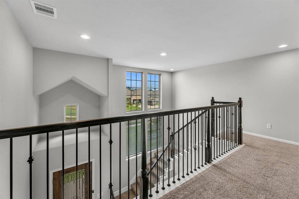Upstairs, you'll find a spacious game room perfect for entertainment or relaxation, along with a full bath and two additional secondary bedrooms—ideal for family, guests, or a private retreat for children.