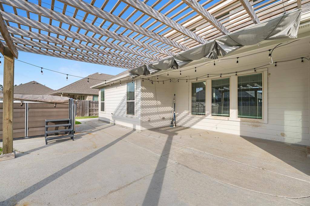The sellers have thoughtfully added a pergola and extended the concrete patio, providing ample space for outdoor dining or a cozy living room setup near the swim spa. Curtains have been added to the pergola for extra shade and sun protection, making this outdoor space comfortable and inviting all year round.