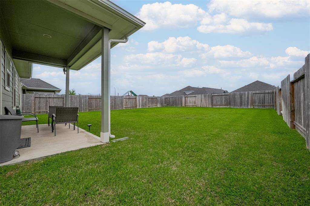 Enjoy the rare find of a spacious backyard that truly sets this home apart—larger than what you'll find with many homes in this price range.