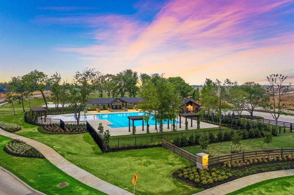 Imagine hosting summer barbecues or enjoying quiet mornings in this generously sized backyard—offering more space than many homes in the area and endless possibilities for outdoor living.