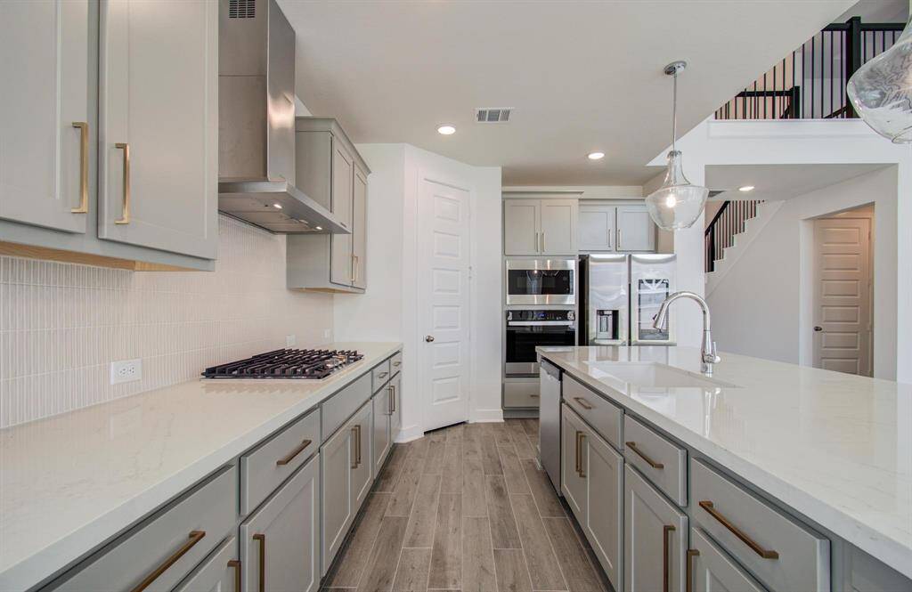 Quartz countertop and designer accent color cabinets