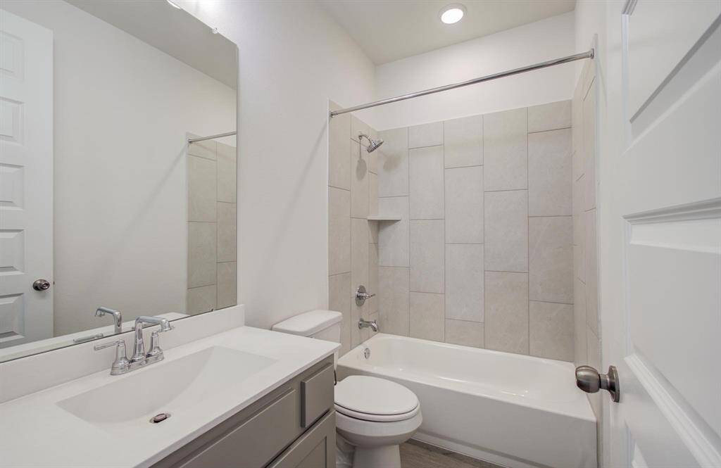 Full bathroom downstairs just off secondary bedroom