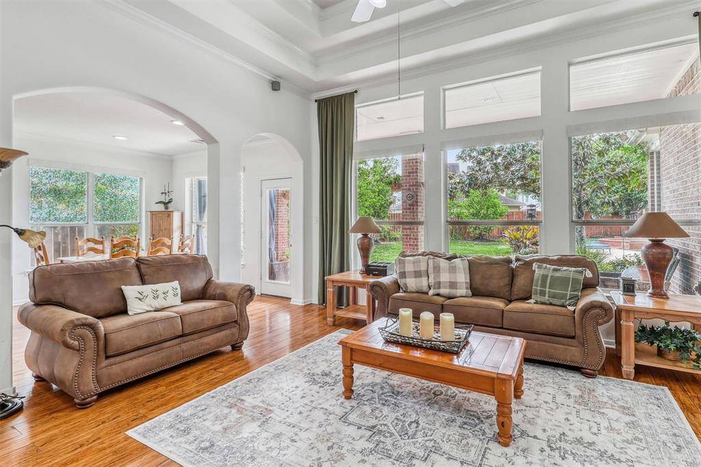 Beyond their aesthetic beauty, the windows frame stunning, uninterrupted views of the backyard paradise—lush landscaping, inviting outdoor spaces, and serene greenery come together to create a picturesque backdrop.