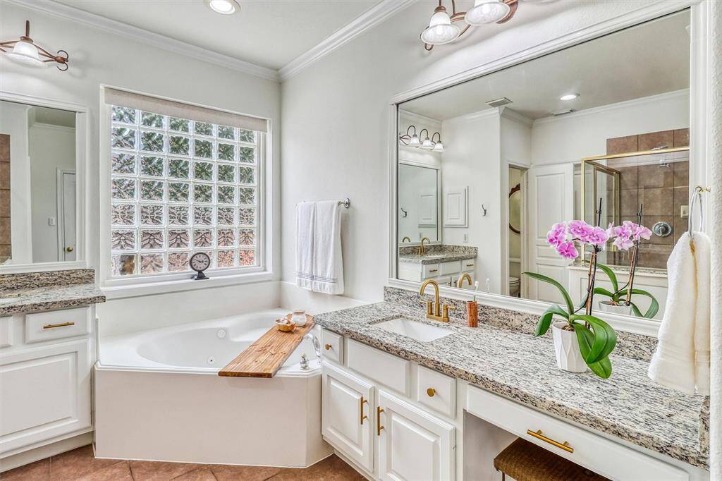 The recently updated primary en-suite bathroom is a luxurious retreat, thoughtfully designed with comfort and elegance in mind.