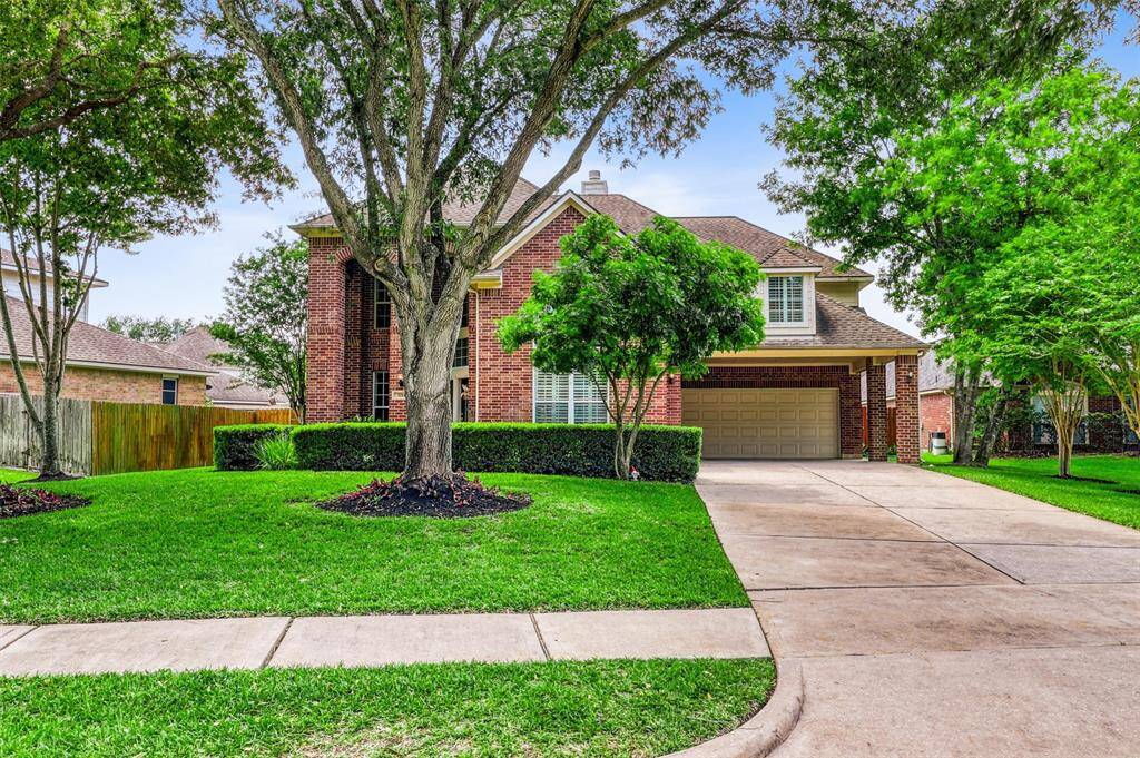 A spacious double-wide driveway welcomes you to a two-car attached garage, complemented by a stylish and functional porte-cochère for added convenience.