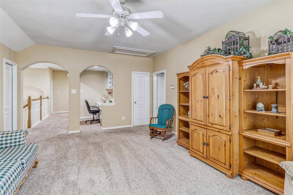 Spacious and bright, this versatile game room is ideal for entertaining, movie nights, or simply unwinding with family and friends.