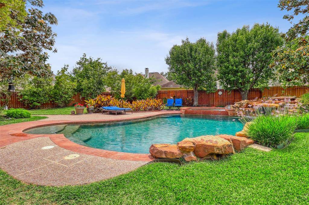 The pool area is surrounded by ample space, providing plenty of room for lounge furniture or even an outdoor dining set, making it ideal for both leisurely afternoons and entertaining guests.