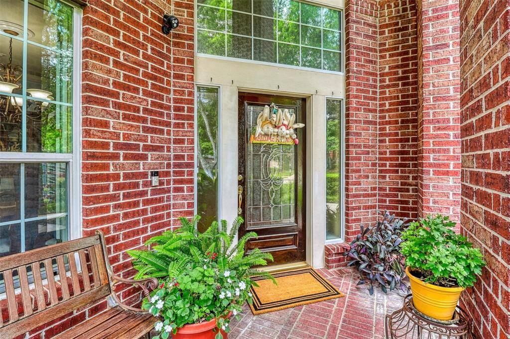 As you approach the home, a charming covered porch extends a warm welcome, inviting you to step closer.