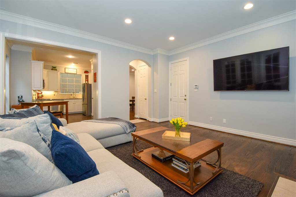 Living room with a view into the kitchen area.