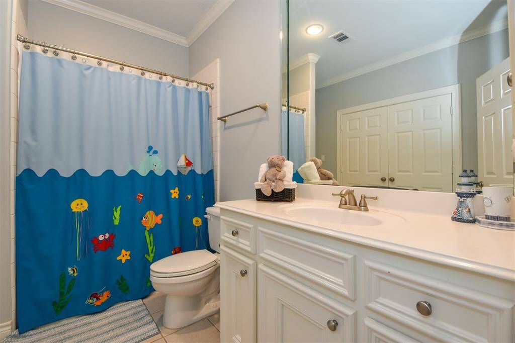 Secondary bathroom features modern fixtures and a clean, classic design