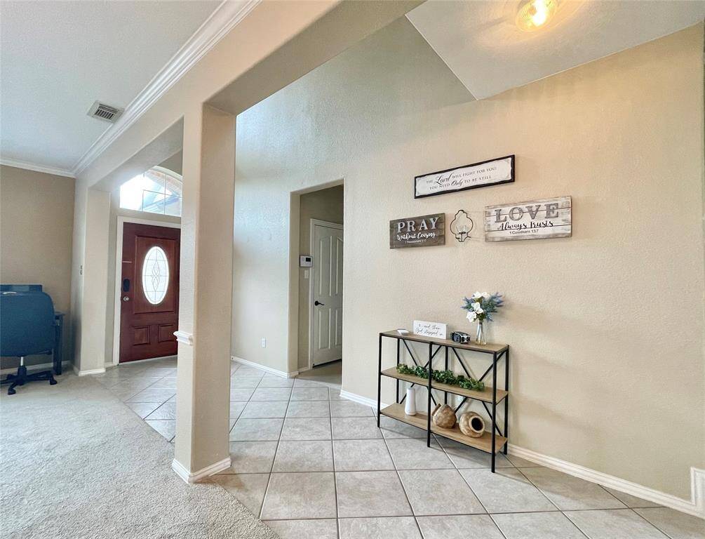 Dramatic foyer opens to formal Living & Dining