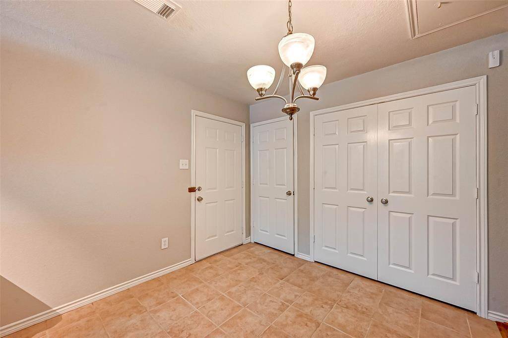 Laundry area is conveniently located towards the back of the kitchen.