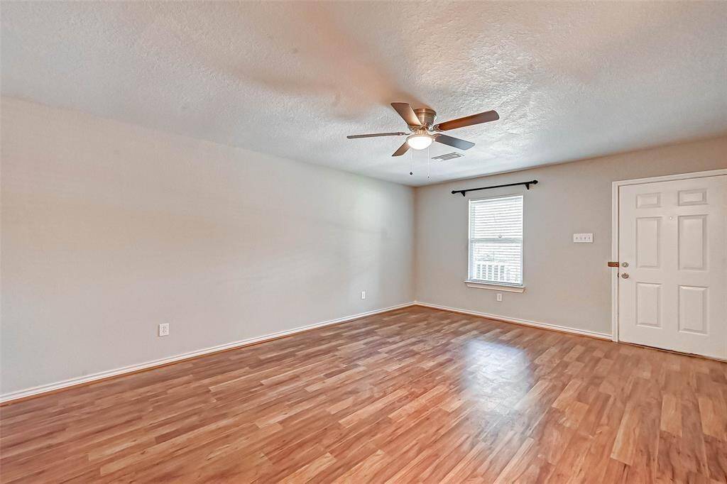 As you enter, you are greeted by the spacious living room.