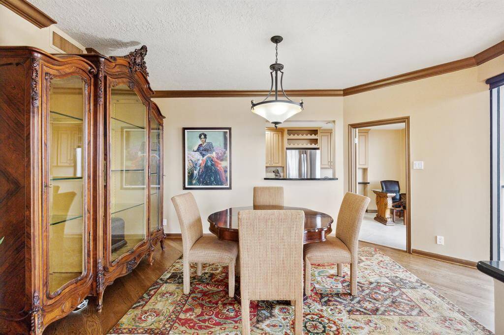 Secondary view to the dining room with access to adjacent rooms is easy through two open doorways.