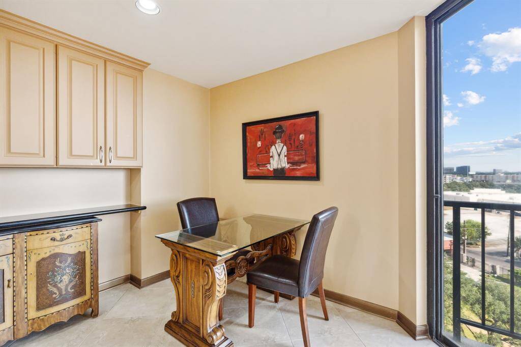 Breakfast nook featuring built-in upper cabinetry for storage.