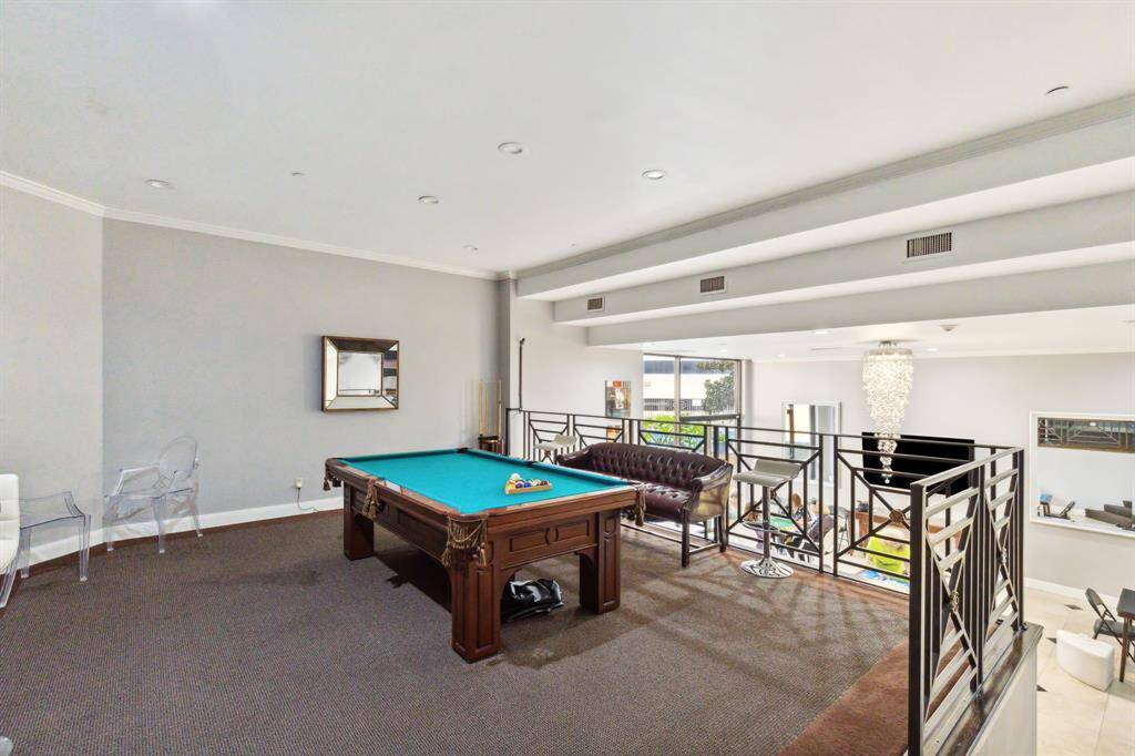 Private room equipped with a bar, ample seating and a pool table available to residents to enjoy.