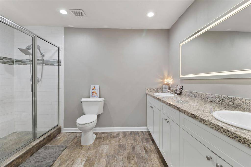 Double sink, walk in shower with bench seating.