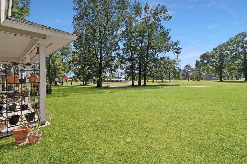 Wide angle shot of the backyard with unobstructed views of the 9th hole and The Club House.