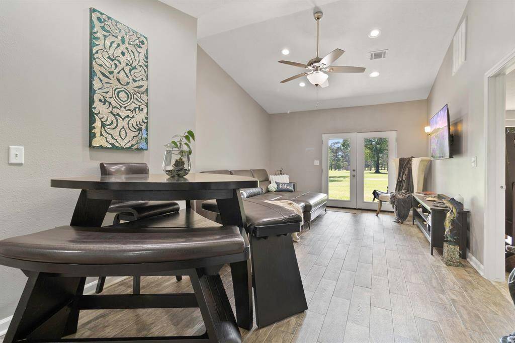 Open floor plan, high ceiling with recessed lighting and ceiling fans, ceramic wood-look tile throughout entire home! *Furniture options available