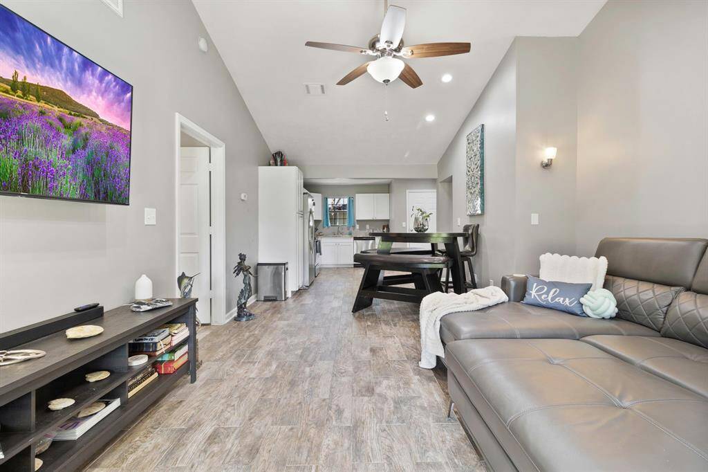 View of open floorplan from French doors at back porch. *Furniture options available