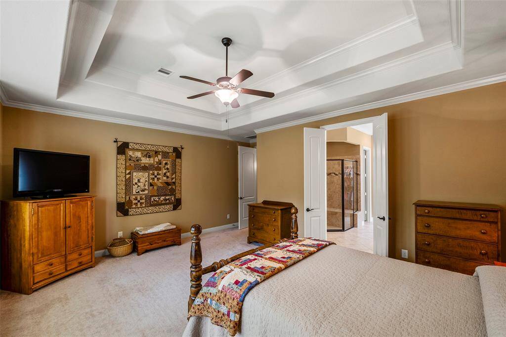 Gorgeous primary suite with tray ceiling.