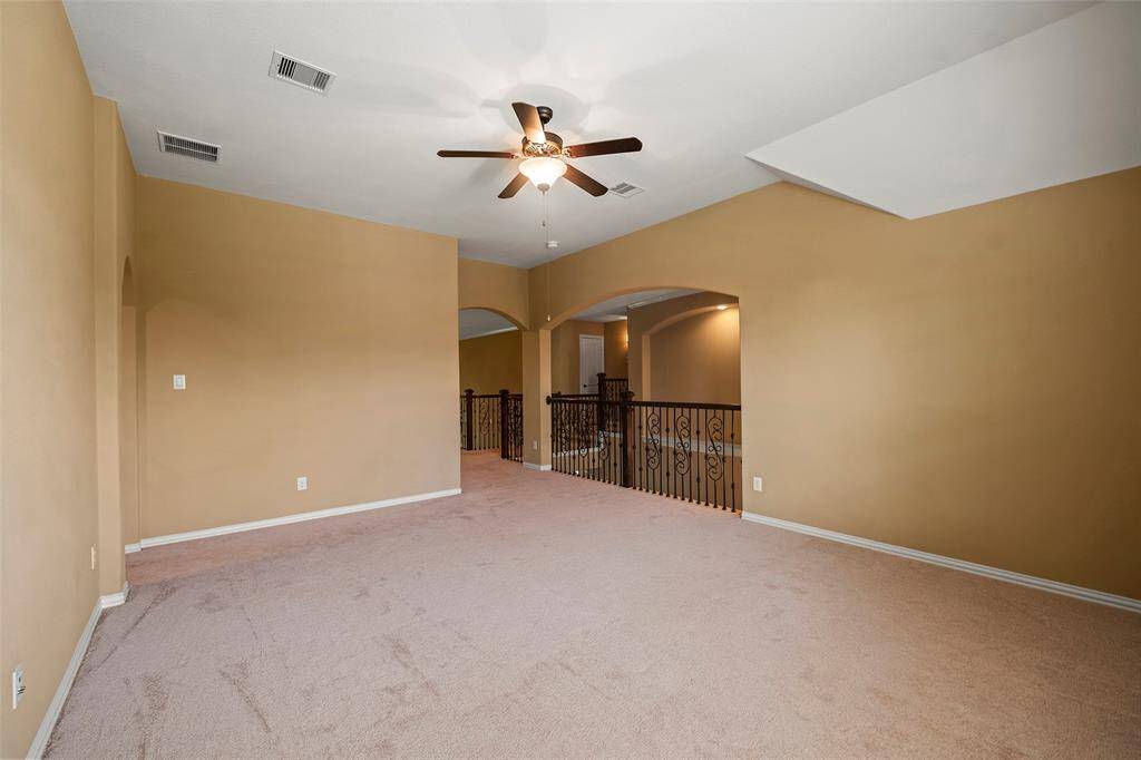 The opposite side of the game room leads to the 4rd bedroom with ensuite bathroom.