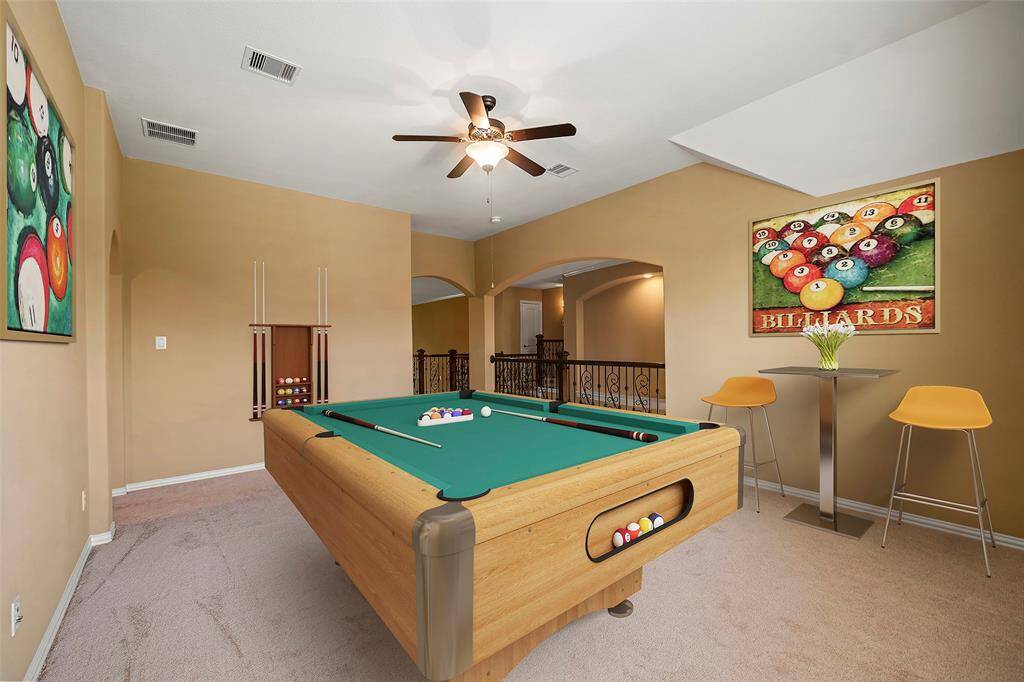 Virtually staged game room.