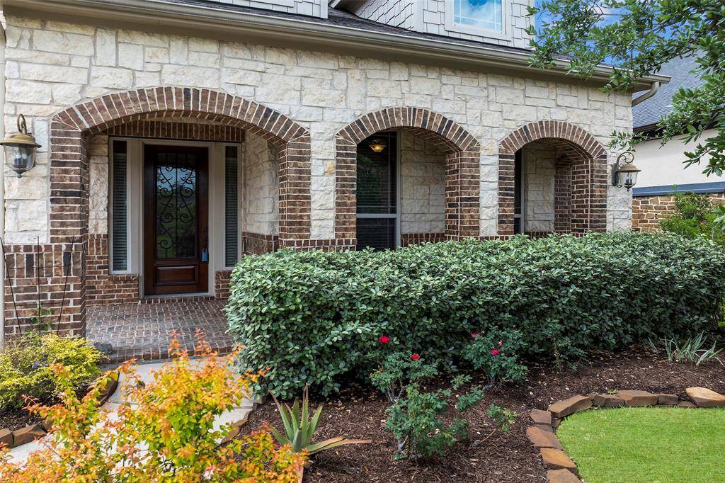 Welcome Home!  The beautiful covered front porch and landscaped yard have great curb appeal.