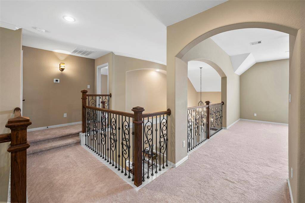 On the opposite side of the game room, the 2 steps lead up to the 4th bedroom.