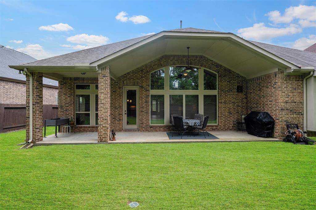 Spacious covered back patio, perfect for your next BBQ.