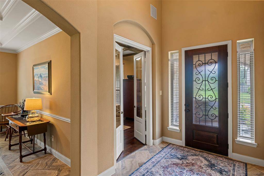 Upon entry, you are greeted by the french doors of the home office.