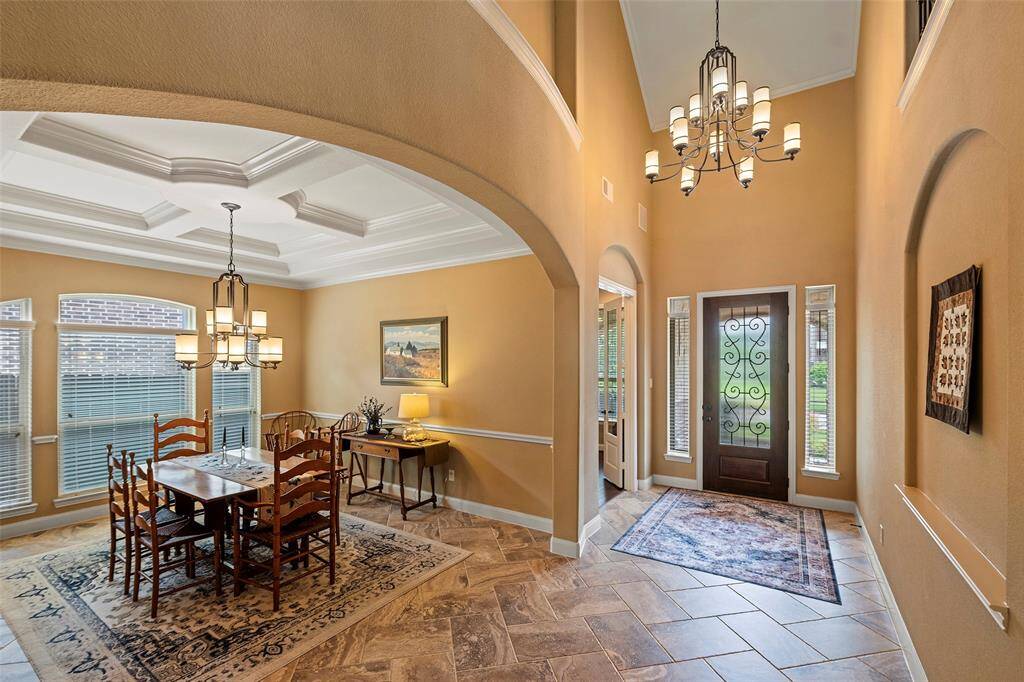You'll love all the special touches with art niches, crown molding, and arched doorways.