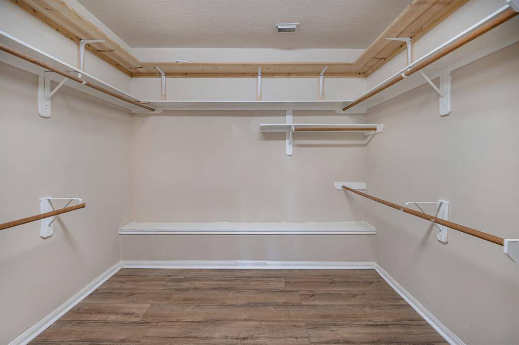 Large walk-in primary closet.