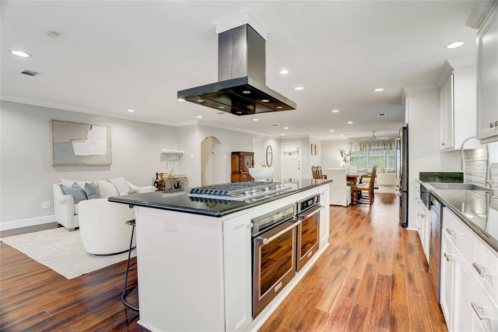 The Kitchen, open to the Den, Dining Room & Family Room.