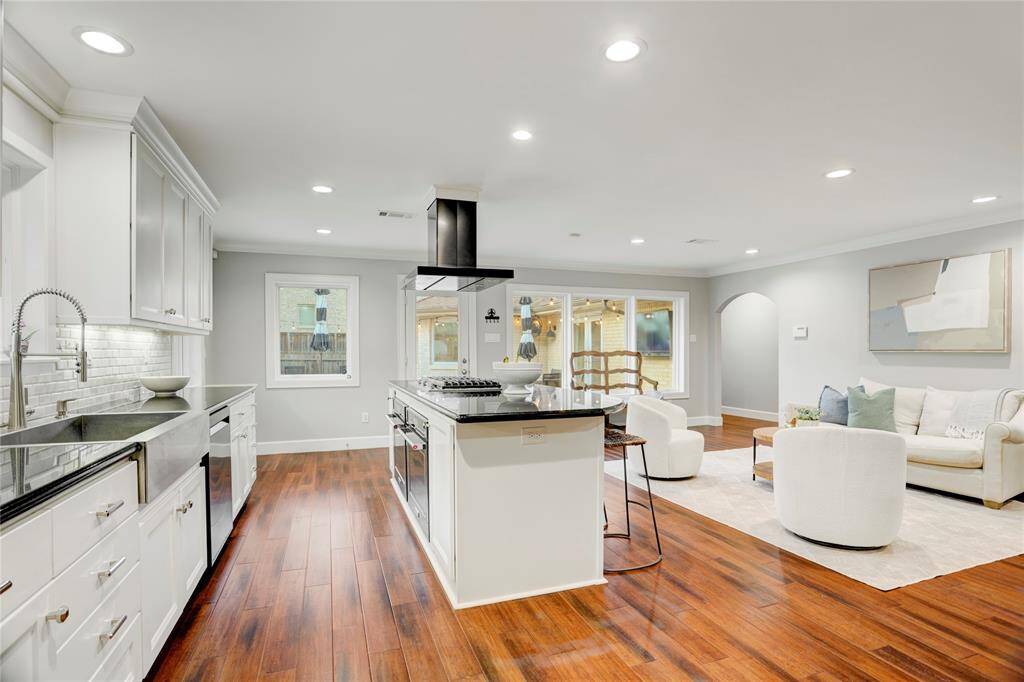 Large windows and glass doors throughout this beautiful home allow wonderful natural light to pour in.