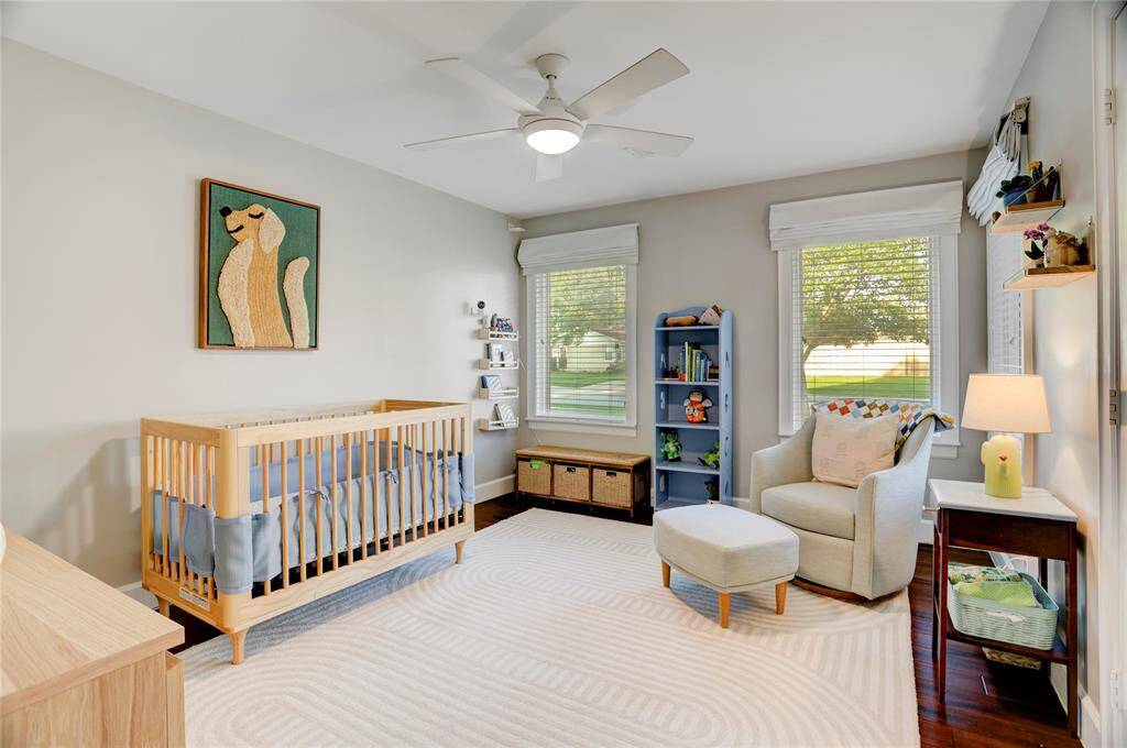 1 of 2 large Secondary Bedrooms with spacious closets, large windows with custom window coverings providing wonderful natural light and bamboo floors.