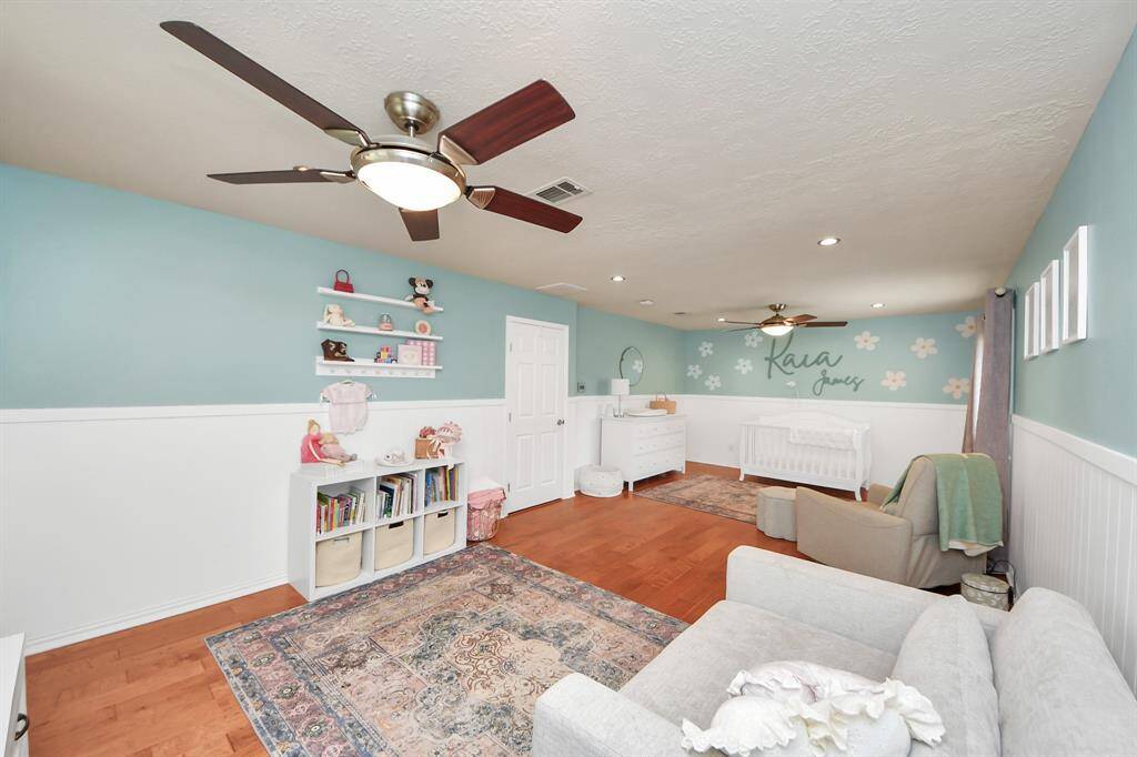 This flexible space can serve as a nursery, home office, or be converted back into two bedrooms—owner has already drawn up plans for the layout!