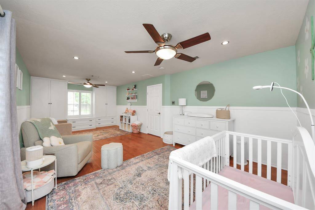 This flexible space can serve as a nursery, home office, or be converted back into two bedrooms—owner has already drawn up plans for the layout!