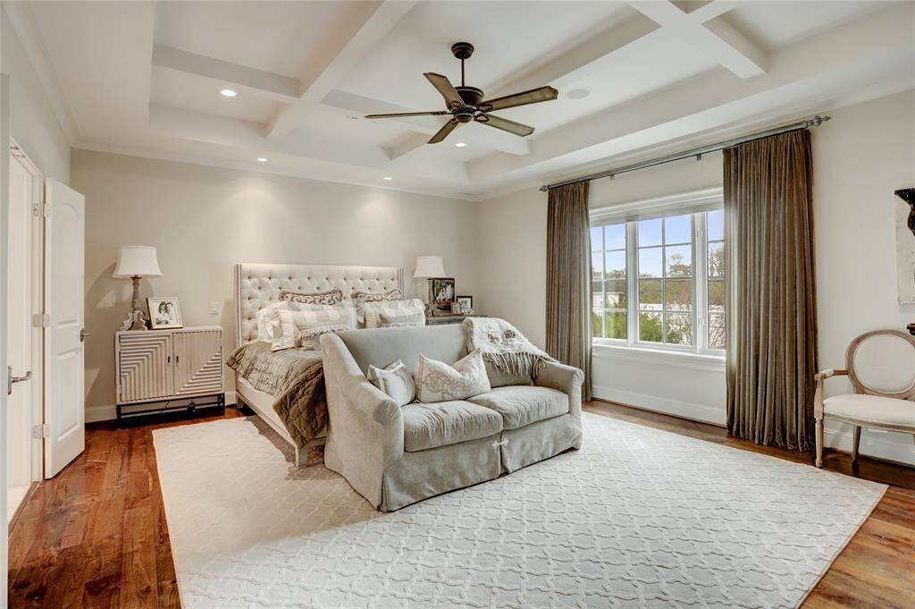 Generous primary suite with coffered ceilings