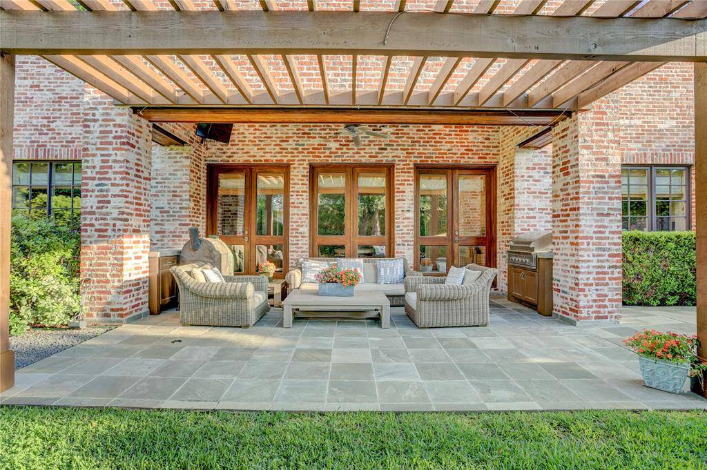 Inviting outdoor living spaces with outdoor kitchen off the family room and kitchen.