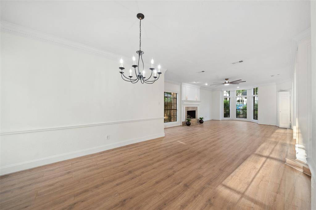 Spacious dining room designed for formal meals and gatherings, featuring elegant crown molding and detailed woodwork that add a touch of sophistication to the space.