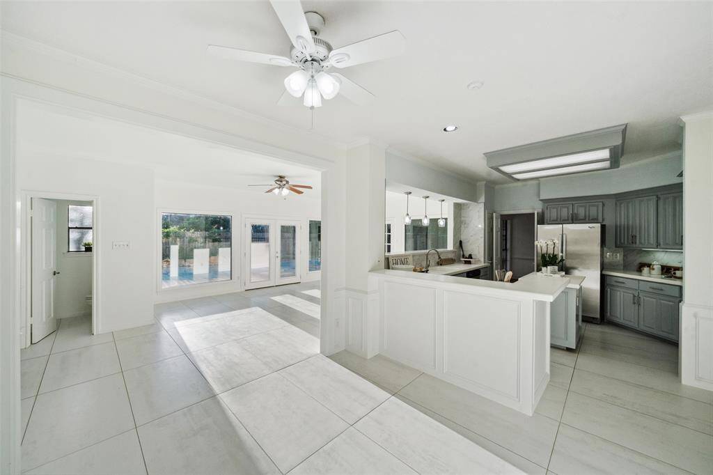 Cozy kitchen with a charming view of the backyard, perfect for preparing meals while enjoying the outdoor scenery.